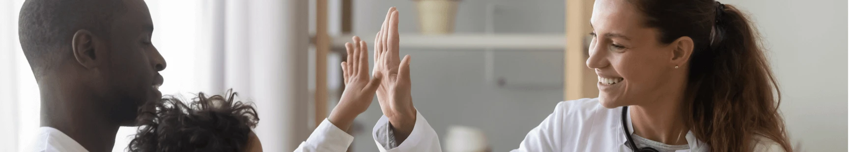Doctor high-fiving patient